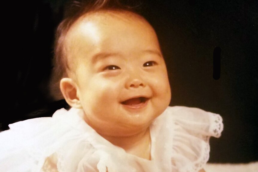A six-month-old female South Korean baby smiling