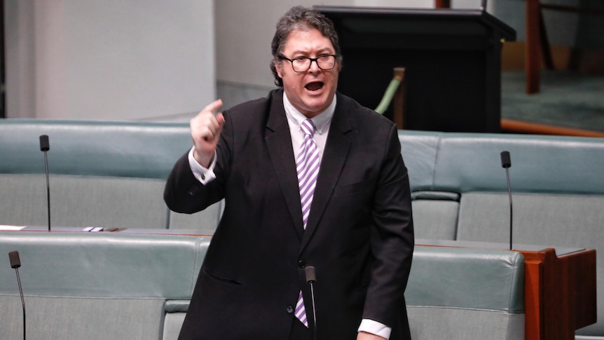 A man shouts and points his finger while making a speech inside the House of Representatives at Parliament House.