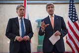John Kerry and British Foreign Secretary Philip Hammond address the media.