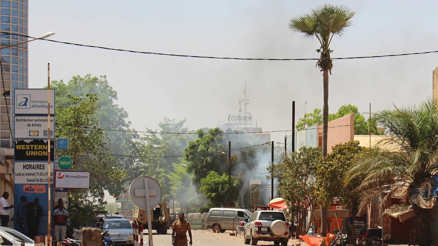 A soldier walks near the rear of the Army Headquarters in central Ouagadougou, Burkina Faso.