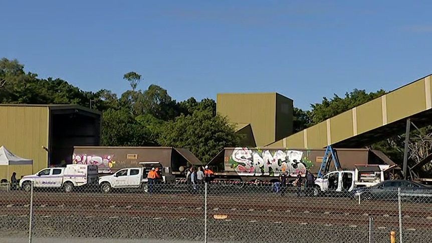 Police cars at a shed at the Port of Brisbane where a man's body was discovered on July 12, 2017