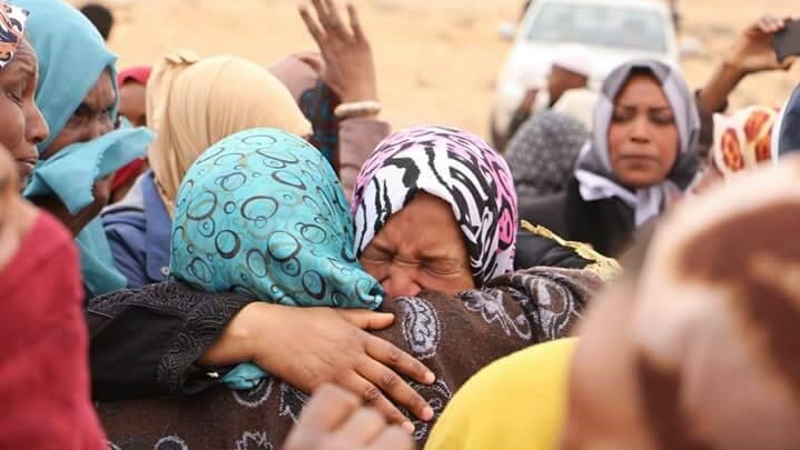 A group of women from Tawergha hug and cry