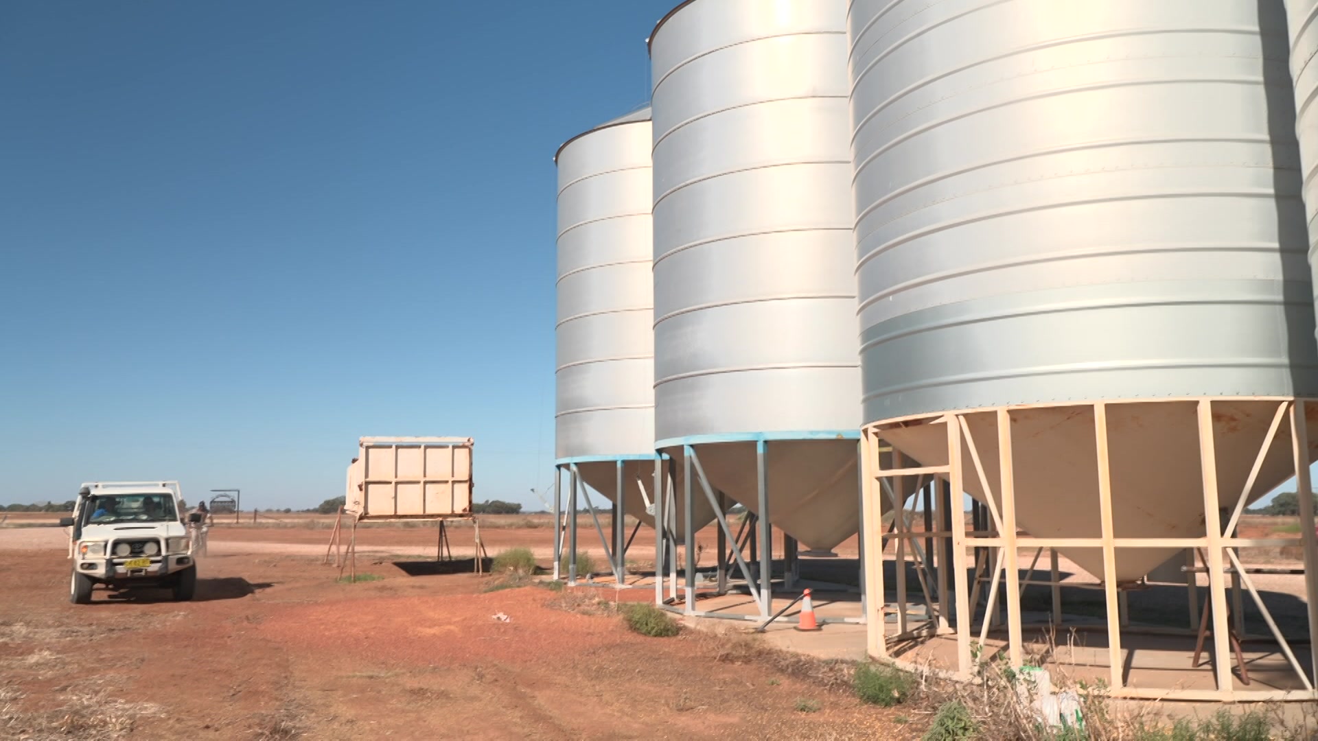 Three silos and a ute.