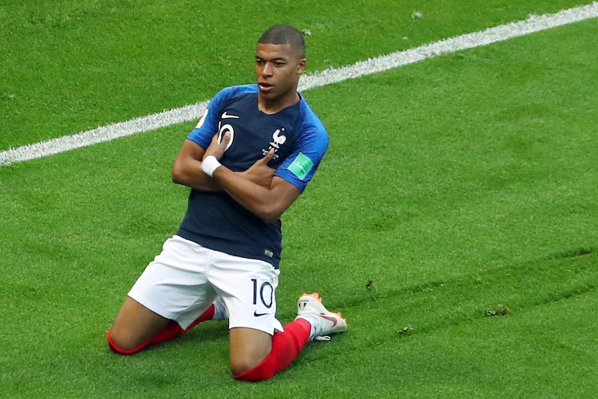 France's Kylian Mbappe celebrates scoring against Argentina at the World Cup on June 30, 2018.