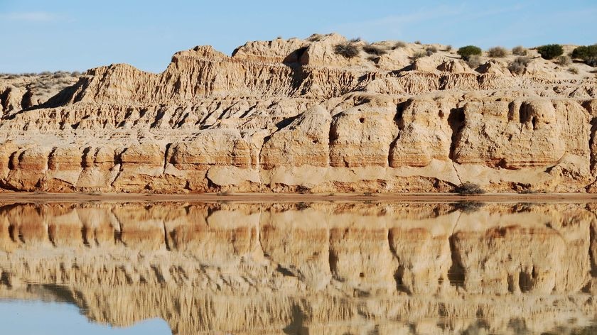 The terrain around Warburton Creek reflects in the creek's waters