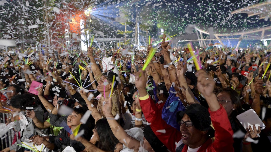 Confetti falls on revellers during New Year's Eve celebrations.