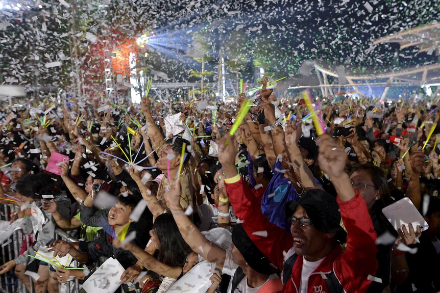 Confetti falls on revellers during New Year's Eve celebrations.