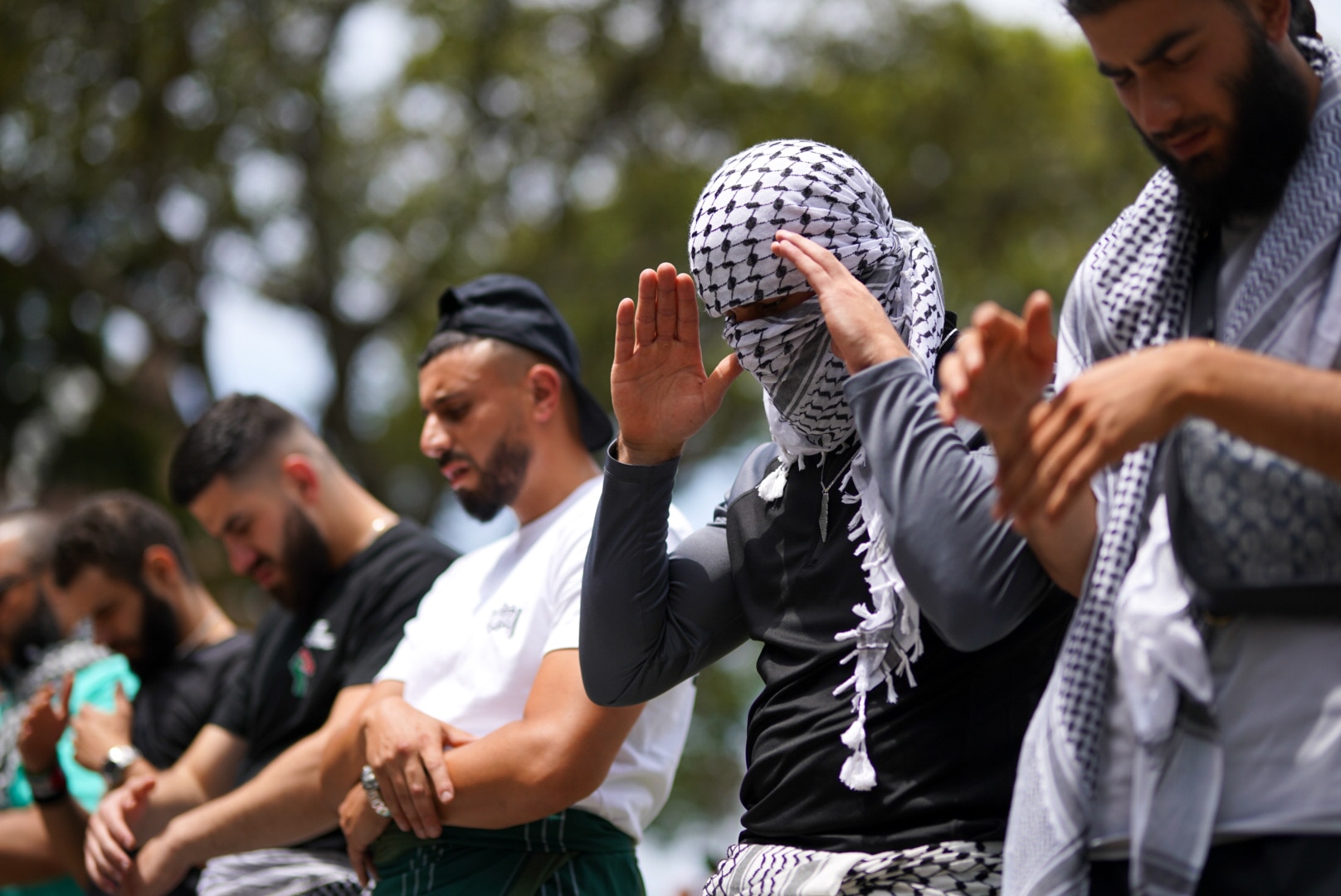 Men praying at pro-Palestinian rally in sydney's hyde park 