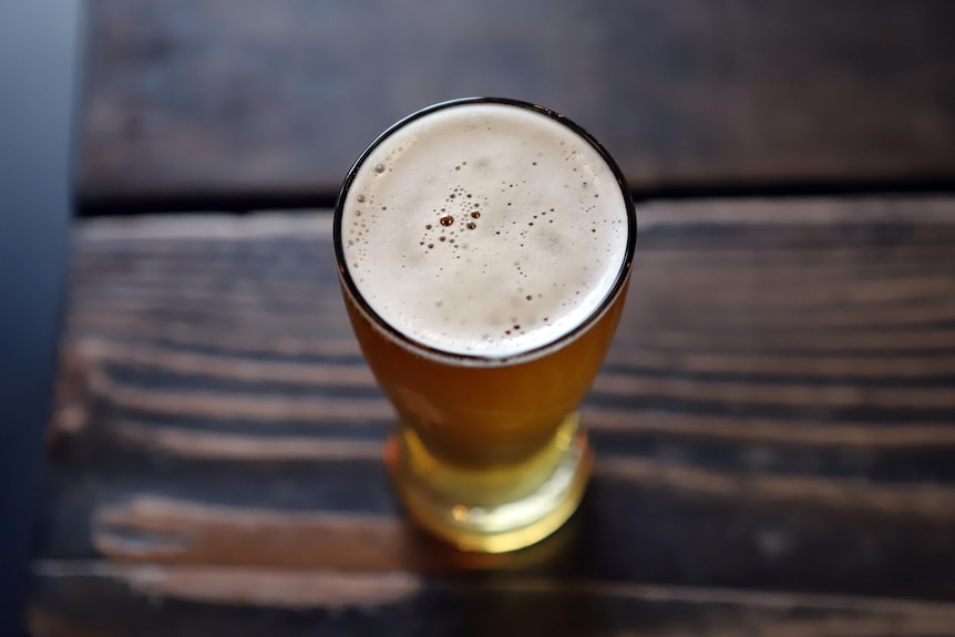 Beer in a glass on wooden table