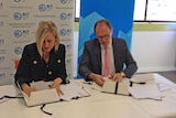 Katy Gallagher and Professor Stephen Parker sign a Heads of Agreement.