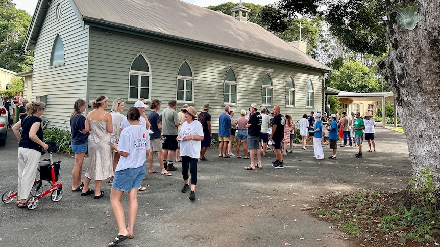 people lining up outside a church