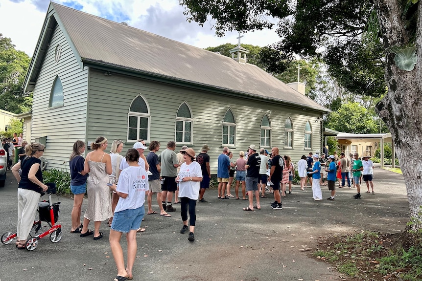 people lining up outside a church