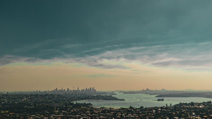 Aerial shot of Sydney's skyline. There is some smoke haze.
