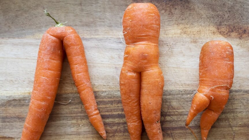 three off shaped carrots