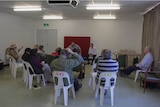 A crowd of people listen to a briefing from federal bureaucrats in Laverton, Western Australia.