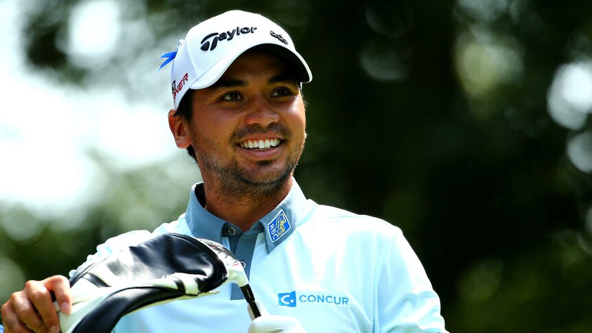 Jason Day smiles during the first round in Boston