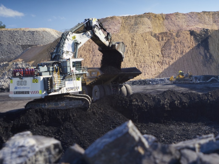 Coal is dug out and loaded into a truck at a mine