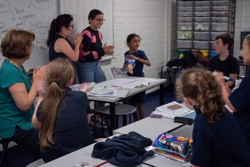 Jacqueline Chan and Tyra Simons hand out prizes at learning club.