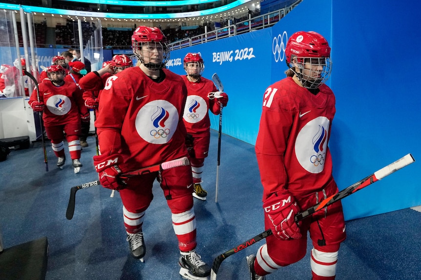 Russian Olympic Committee players leave the ice before a preliminary round women's hockey game against Canada