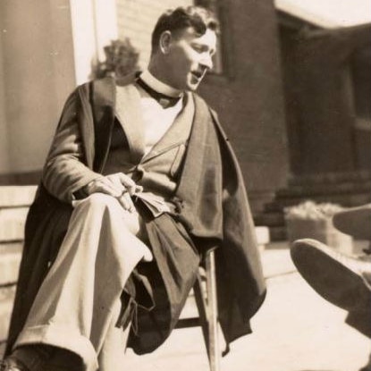 A old photo of a teacher in an academic gown