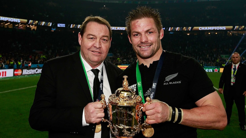 Dynamic duo ... All Blacks coach Steve Hansen (L) and captain Richie McCaw pose with the Webb Ellis Cup