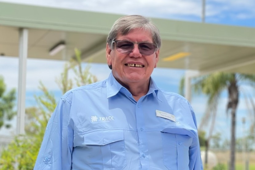 man in blue shirt wearing glasses