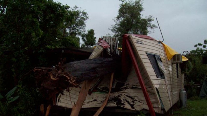 A man had a lucky escape when a gum tree crashed into a demountable unit in Weipa.