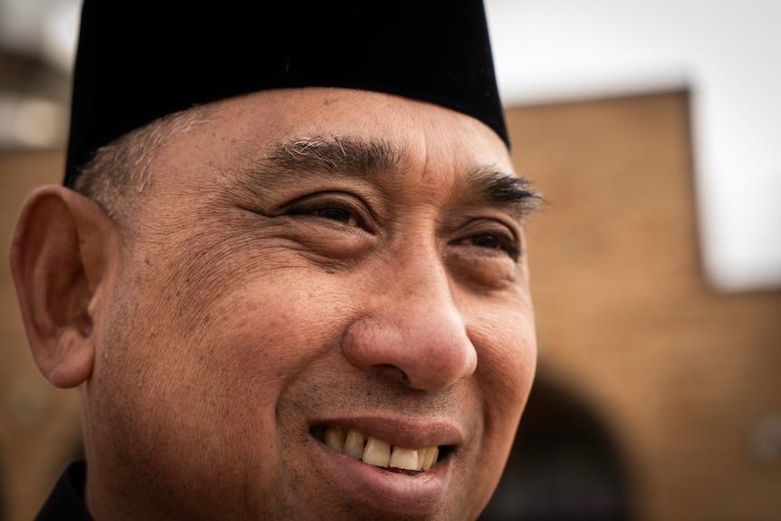 man in front of mosque