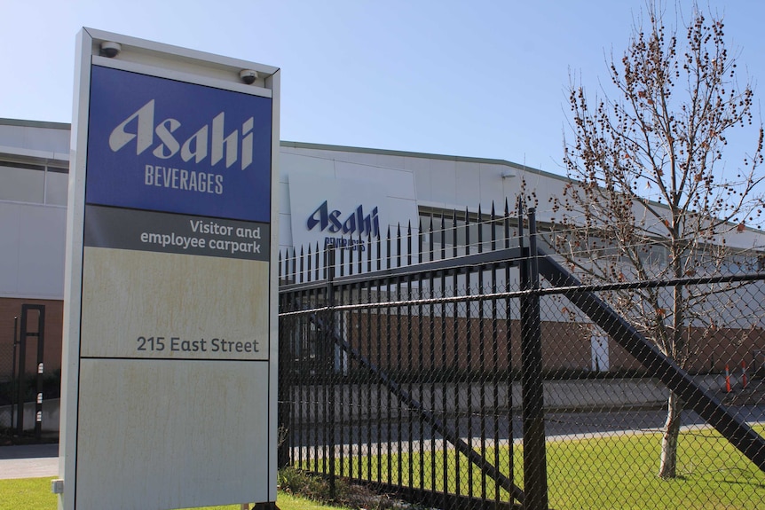 The Albury Asahi factory sign with barbed wire behind it