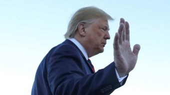 Donald Trump waves his hand