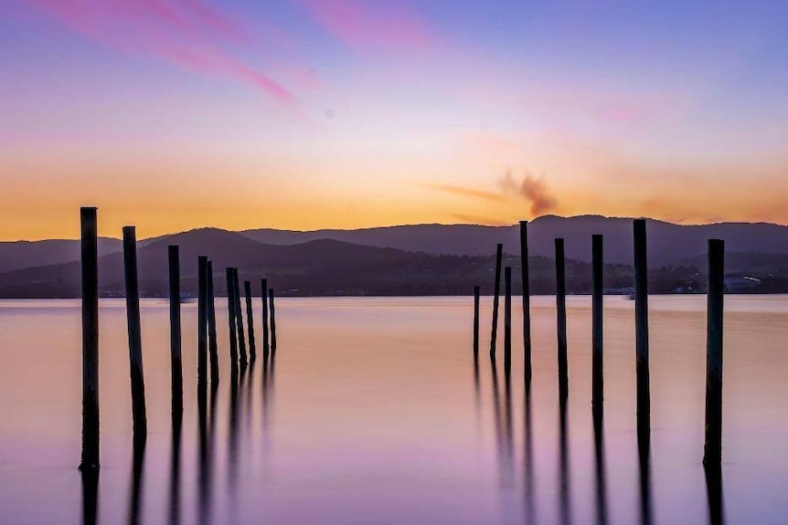 Colourful sky and old jetty.