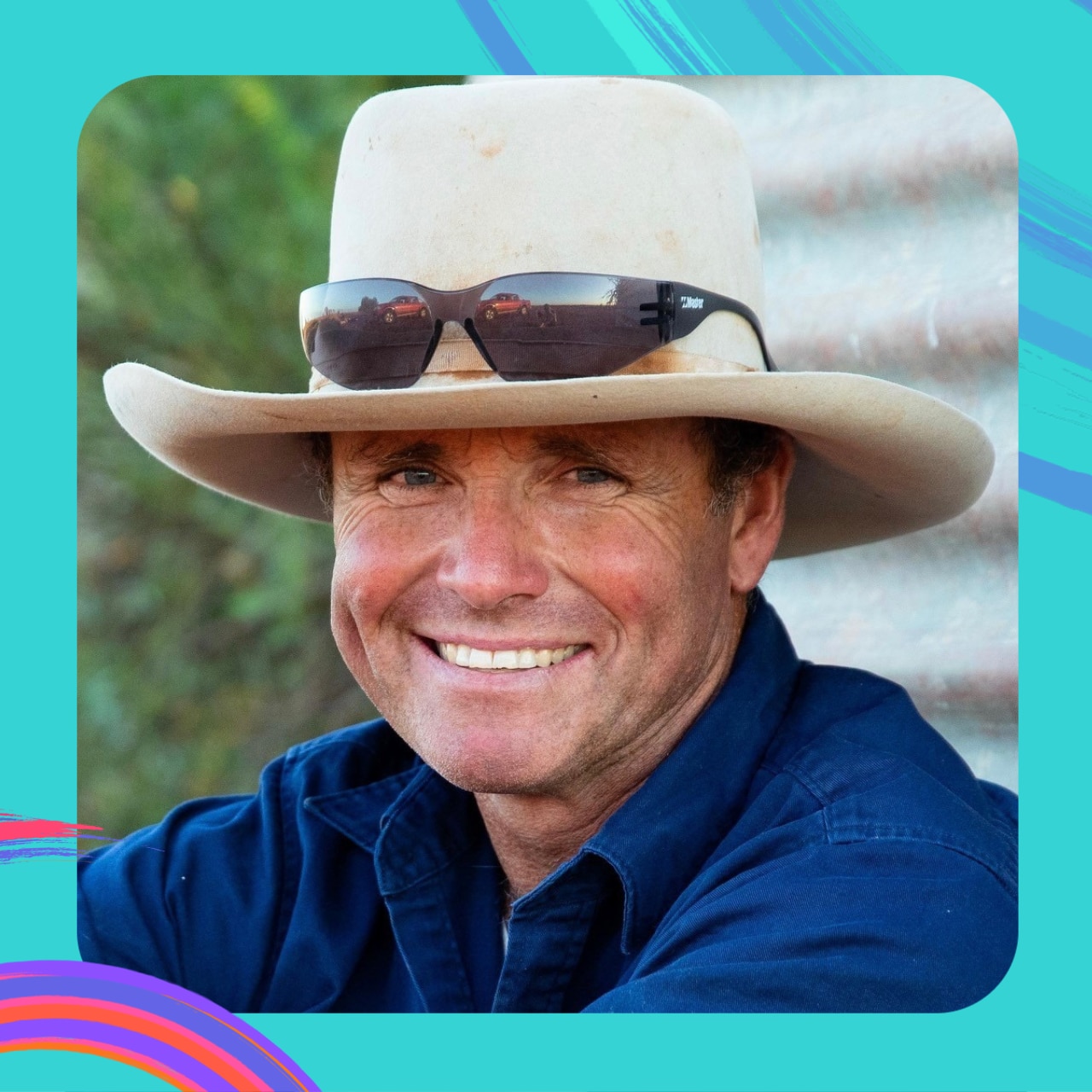 A portrait of farmer Brendan Cullen wearing an Akubra and smiling broadly.
