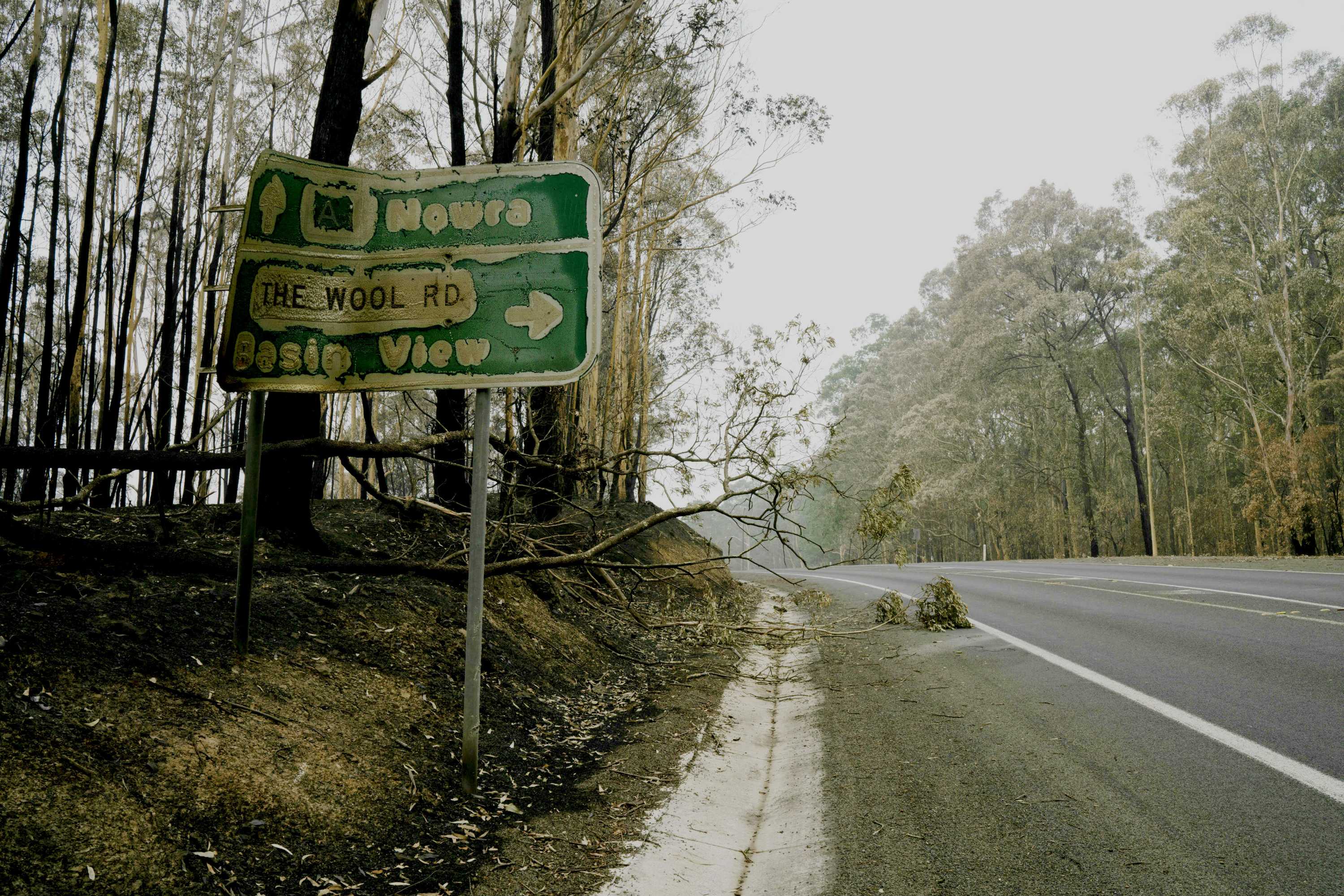 A burnt street sign on a highway