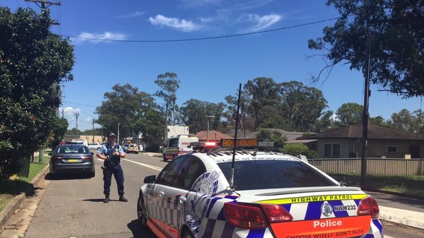 Policeman and car on road at Quakers Hill