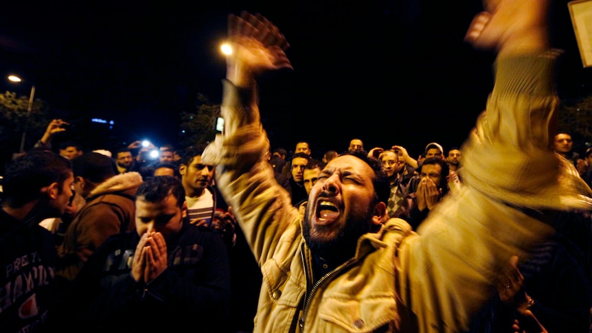 A man reacts to the Port Said stadium riots