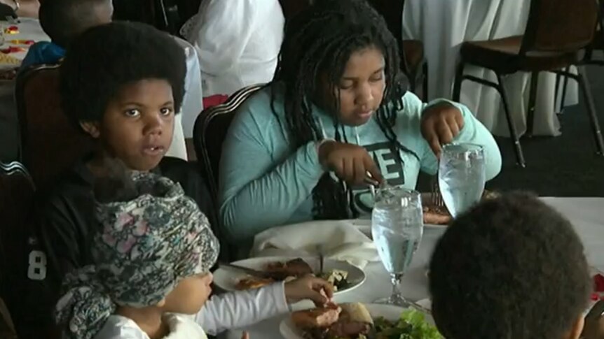 Homeless children enjoy wedding feast
