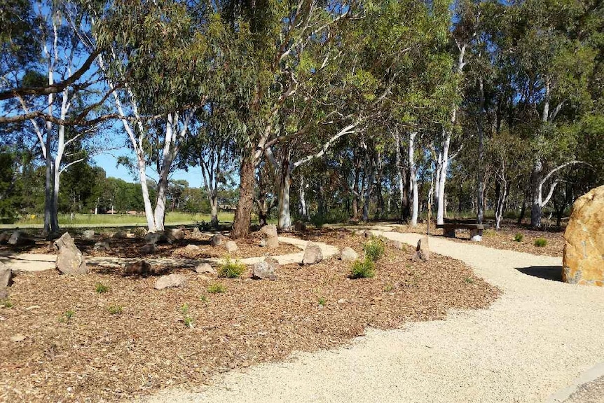 The burial ground, with a large stone at the entrance.