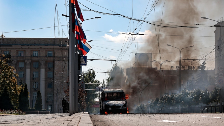 A vehicle on fire after shelling in Russian-controlled Donetsk