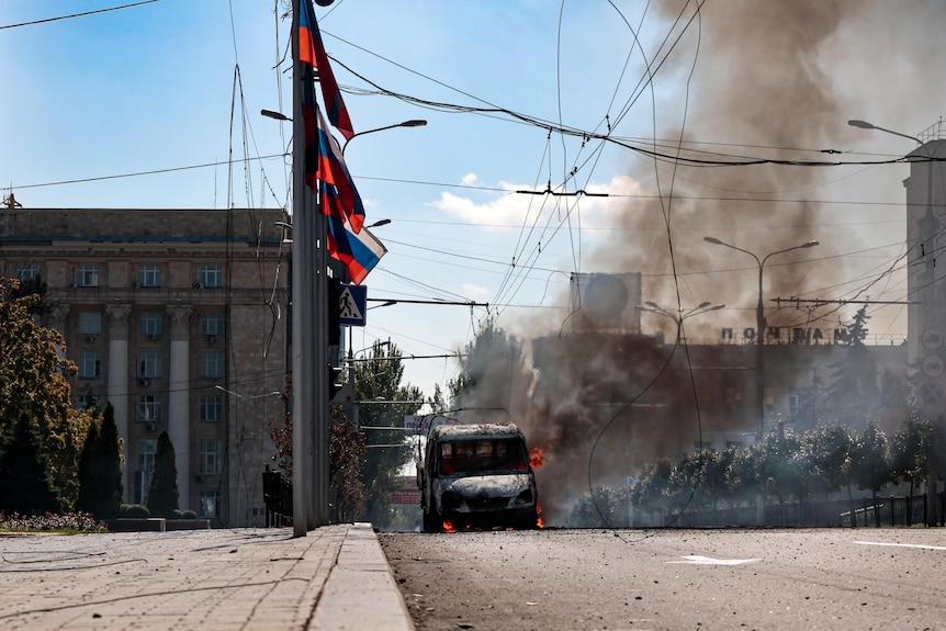A burning vehicle after being shelled in Russian-controlled Donetsk