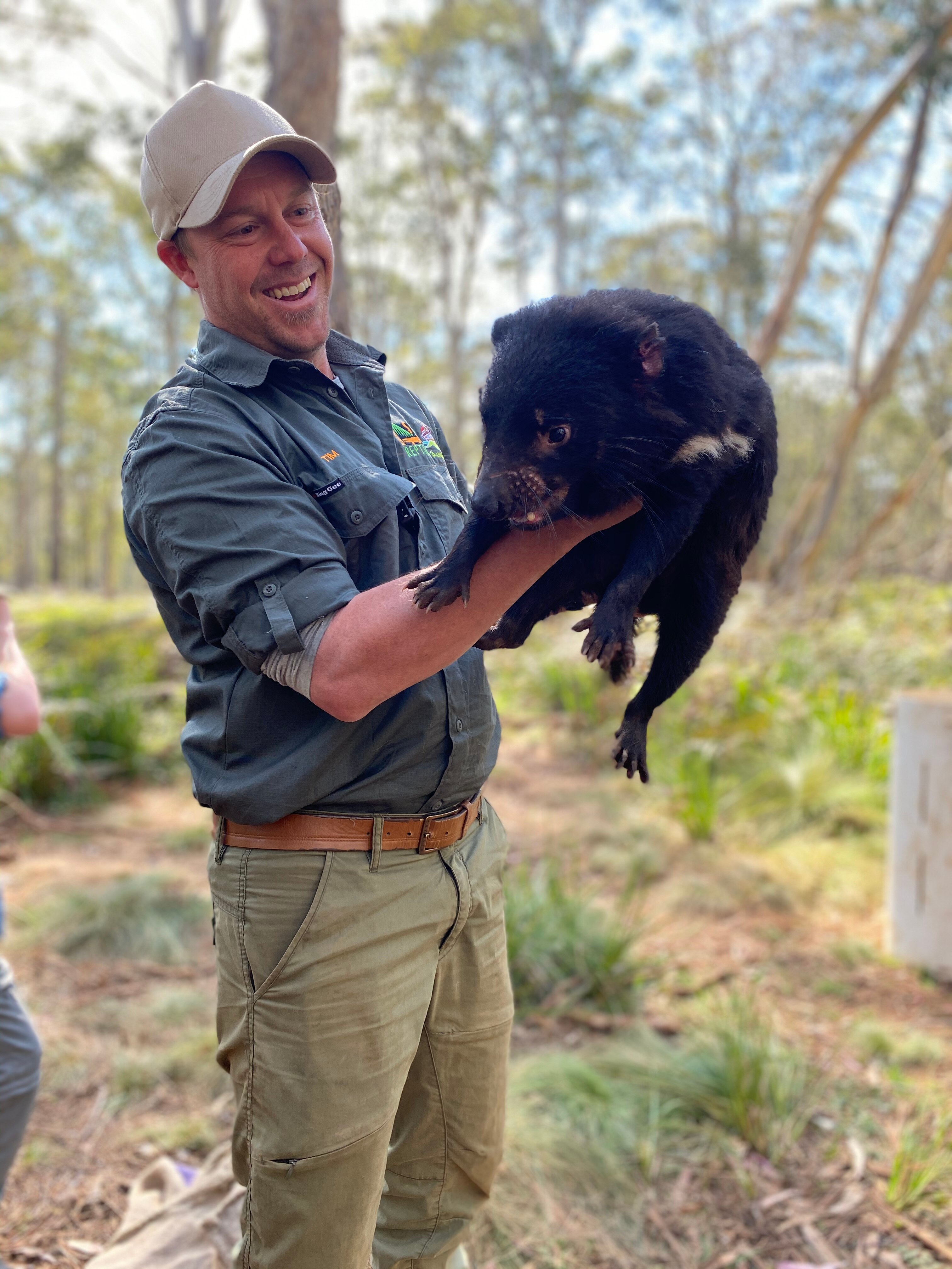 Man holds Tasmanian devil