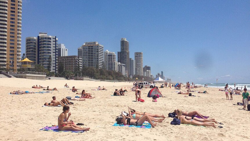 Tourists on the beach at Surfers Paradise.