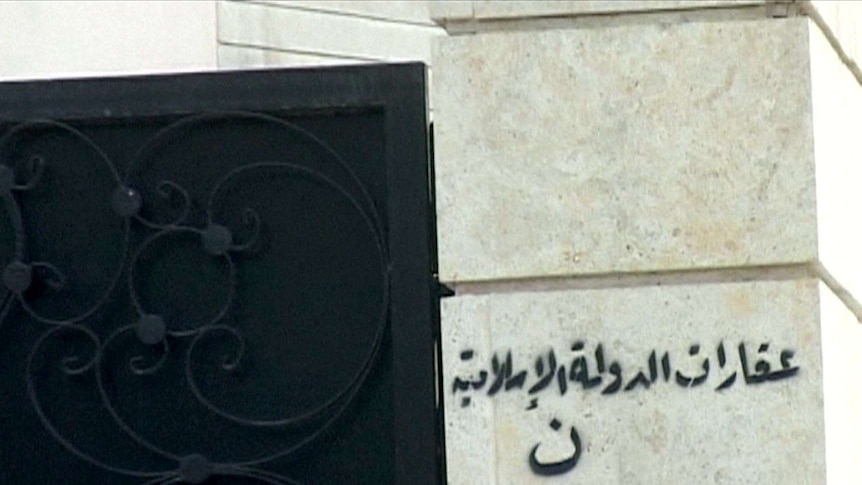 Arabic graffiti on a church in Mosul reads: "Real estate property of the Islamic State."