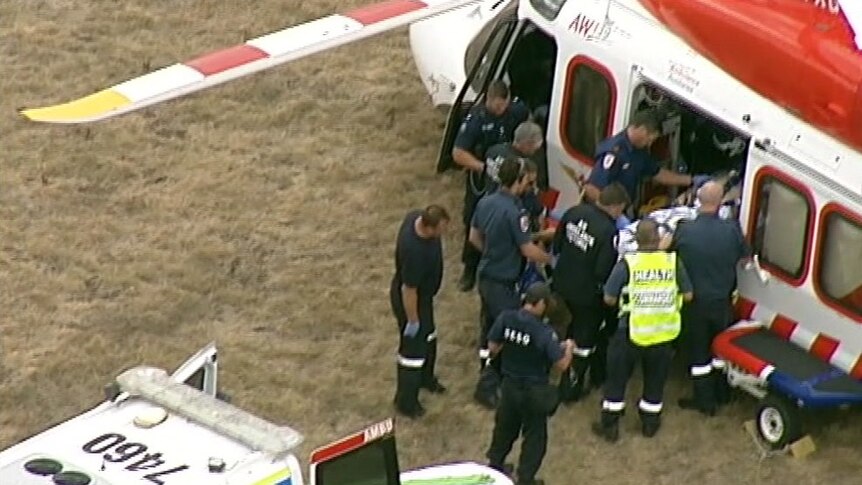 A patient is loaded into an air ambulance.