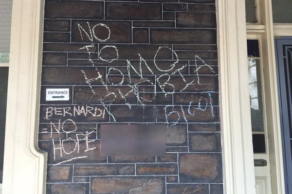 Protesters used chalk to write on the walls of Senator Cory Bernardi's office.