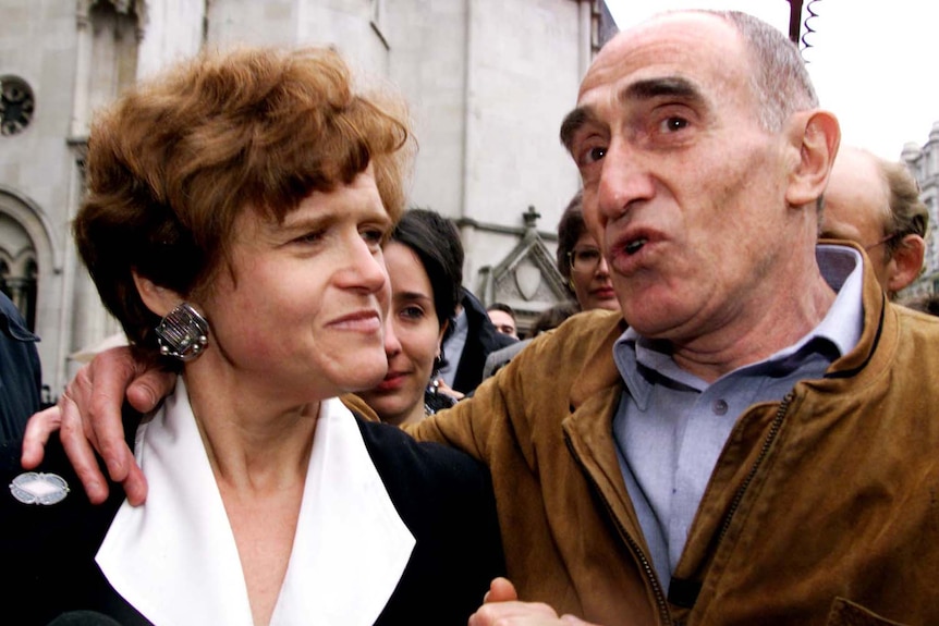 Deborah Lipstadt is congratulated by Holocaust survivor Martin Hecht as she leaves the High Court in central London.