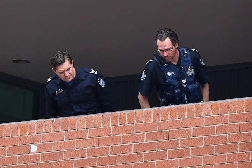 Police look over the crime scene at Somerville House girls school where a security guard was stabbed multiple times in Brisbane.