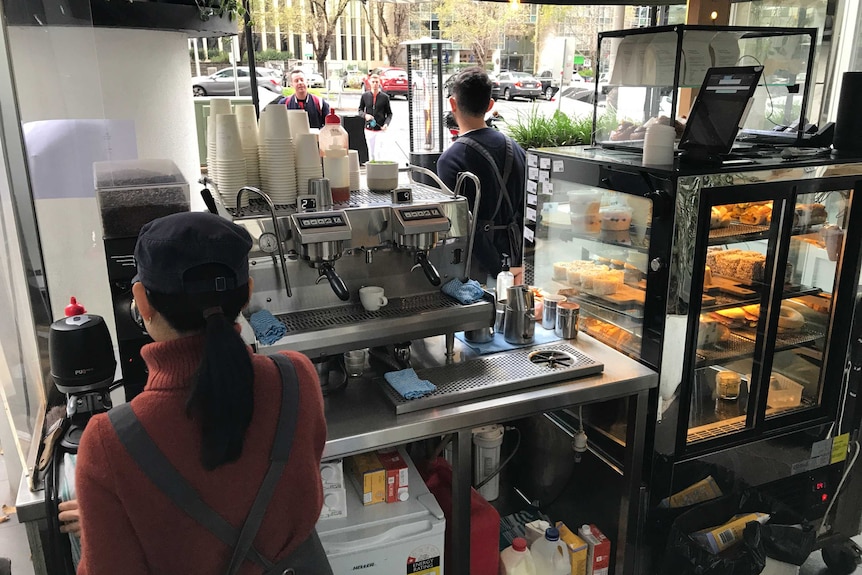 A view behind the coffee machine of a Melbourne cafe.