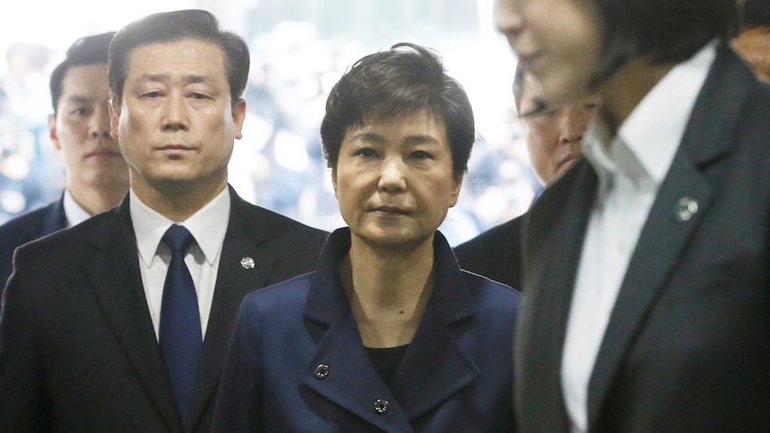 Ousted South Korean President Park Geun-hye arrives for questioning on her arrest warrant.