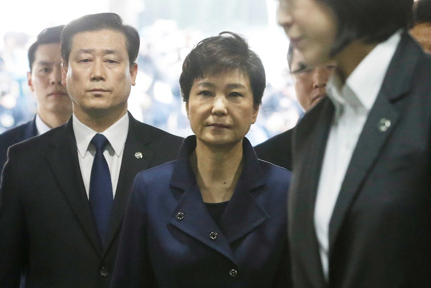 Ousted South Korean President Park Geun-hye arrives for questioning on her arrest warrant.