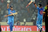 Suresh Raina (2nd L) and Virat Kohli celebrate India's win over Pakistan at the World T20